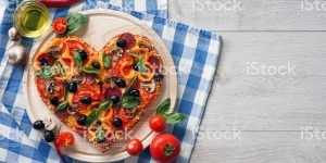 Delicious pizza served on white wooden table. High resolution product. Close up